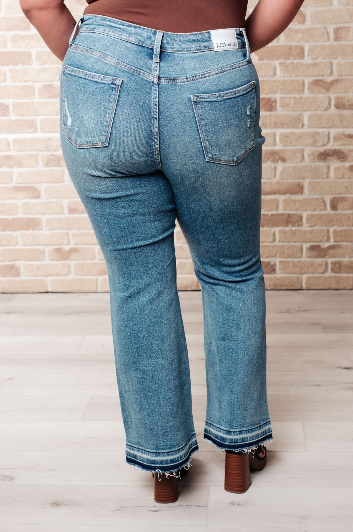 Isla Mid Rise Distressed Released Hem Bootcut Jeans Judy Blue